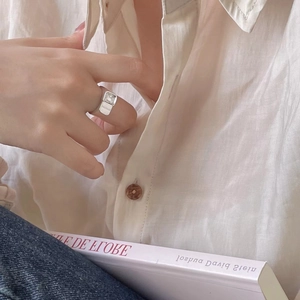 Minimalist 925 sterling silver ring with square white zircon worn by a female model