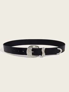 Detail of black leather belt with silver rhinestone western buckle and metal tip