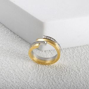 Two-tone rose gold and silver layered ring with sparkling diamonds in a modern open design