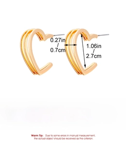 Detail view of triple-layer hollow heart earrings in gold finish with measurements