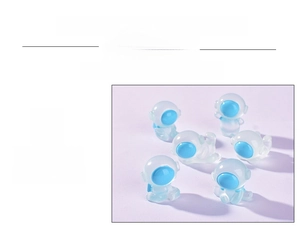 Detailed view of six luminous resin astronaut figurines with blue visors and smooth finish