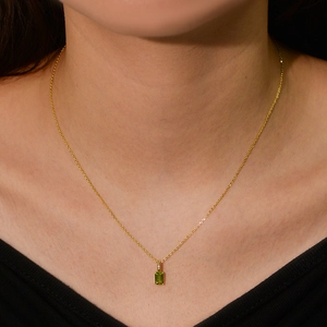Close-up of elegant gold s925 silver necklace with rectangular green amethyst stone