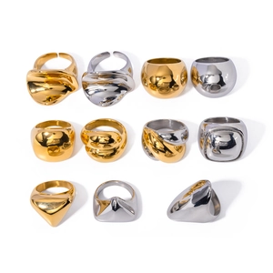 Collection of bold 18K gold and silver chunky stainless steel rings in various shapes