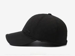 Side view of men's winter baseball cap featuring diamond quilted pattern and metal badge