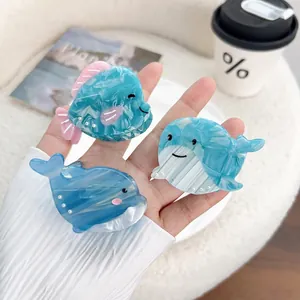 Cute acetate ocean animal hair claws featuring blue tropical fish and dolphin designs