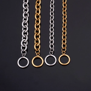 Detailed view of polished gold and silver O-chain necklaces with OT toggle clasps