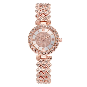 Macro view of rose gold women watch with rhinestone dial and diamond-set metal link band