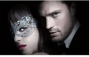 Macro detail of silver lace masquerade mask with intricate cutout patterns and crystal accents