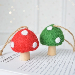 Handmade wool felt mushroom ornaments with wooden bases for Christmas tree decoration