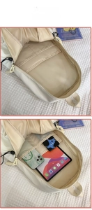 Detail view of the spacious main compartment with tablet and phone storage slots