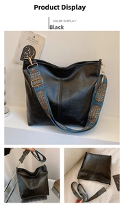 Detail of black bucket bag with vintage textured PU leather and patterned wide strap