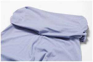 Detail view of high waisted lavender yoga pants featuring smooth flatlock stitching