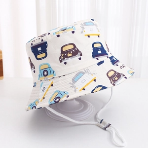 Detail of children's cotton bucket hat with colorful car print and adjustable windproof strap