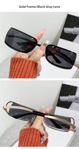 Detail view of gold metal rectangle sunglasses with black lenses and silver studs