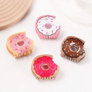 Cute donut hair claws set in 4 colors with bite marks and colorful sprinkles details