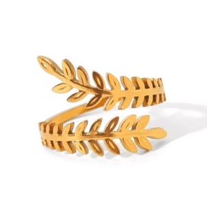 Close-up of golden laurel leaf ring showing detailed textures and adjustable design