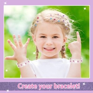 Detail of a girl wearing colorful heart and star gem hair stickers and a DIY clear bracelet