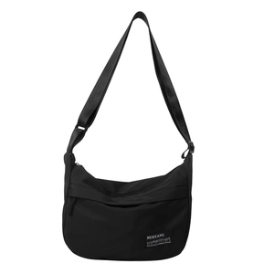 Minimalist black crescent crossbody bag made of durable nylon with adjustable strap
