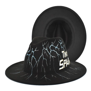 Black wool fedora with white lightning bolt patterns and Tiny Spark side lettering