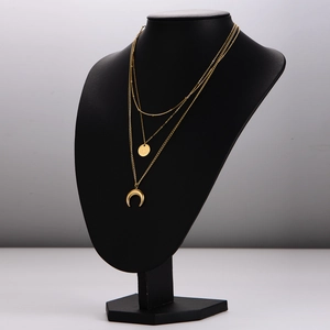 Three-layer stainless steel necklace featuring star moon pendants in golden finish
