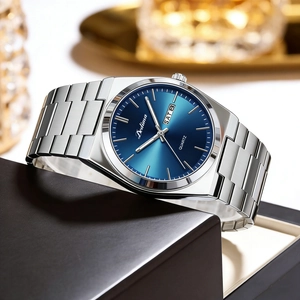 Close-up of elegant men's quartz watch with blue dial and steel strap in luxury box
