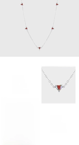 Detail view of 925 silver necklace with pave setting red heart-shaped zircon pendants