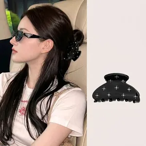 Black starburst rhinestone shark clip for half-up hair styles with elegant starry design