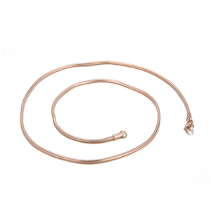 Detailed view of a coiled gold stainless steel snake chain necklace for women