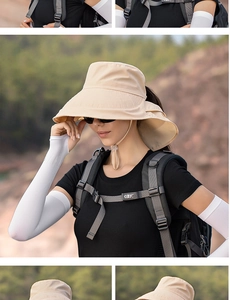Outdoor sun hat with wide brim and matching white cooling sleeves for hiking protection