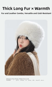 Close-up of white plush faux fur hat showing thick texture and warm fleece lining