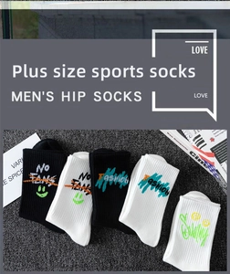 Detail of plus size graffiti sports socks in black and white with knit texture