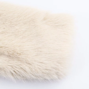 Macro shot of high-quality fluffy faux fur material texture in cream white color