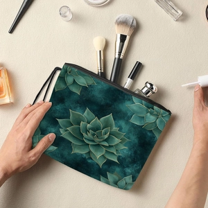 Floral print cosmetic bag with succulents design and zipper closure in a lifestyle setting
