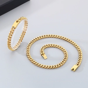 Polished gold stainless steel Cuban link chain set including necklace and bracelet set