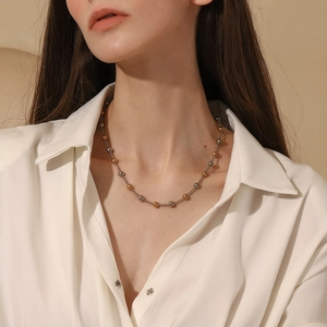 Double-layer 18K gold plated stainless steel necklace with alternating beads on model