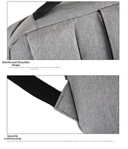 Close-up of reinforced shoulder strap stitching on grey waterproof laptop backpack
