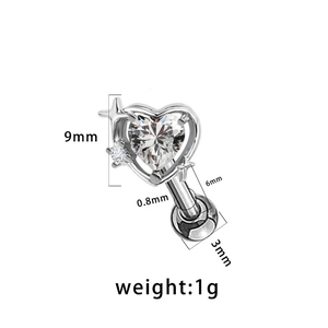 Detailed view of silver heart piercing stud with zircon stone and star engraving