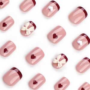 Short square red French press-on nails with 3D white bows and heart patterns