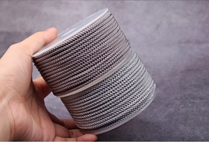 Macro detail of 2mm metallic braided cords in purple and silver grey for DIY jewelry