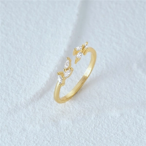 Detailed close-up of S925 sterling silver leaf ring with marquise-cut white zirconias