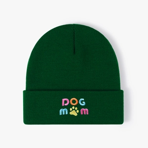 Dark forest green knit beanie featuring a colorful DOG MOM embroidery with a yellow paw print
