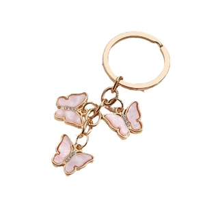 Rose gold metal keychain with three pink acrylic butterfly pendants and small rhinestones