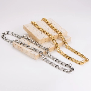 11mm Figaro link stainless steel necklace in gold and silver finish on stone display