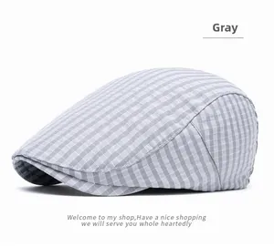 Macro shot of gray plaid flat cap showing fine knit texture and classic British pattern
