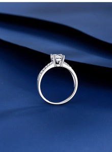 Macro detail of S925 silver four-prong ring with a brilliant round moissanite stone