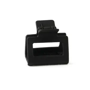 Detail of matte black square hair claw with a durable metal spring mechanism