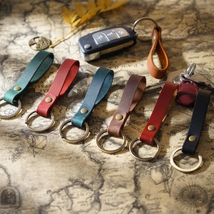 Handmade crazy horse leather mini tape measure keychains in multiple vintage colors