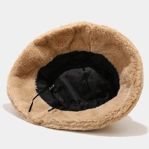 Plush camel bucket hat with cat ears featuring a thick black quilted lining and drawstrings