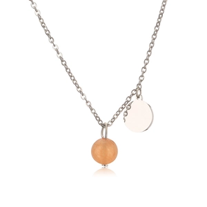 Macro detail of silver stainless steel chain with round stone and flat metal pendants