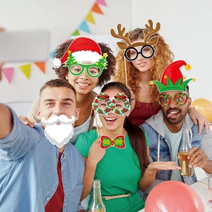 Happy friends wearing Christmas party photo props including Santa beard and reindeer glasses
